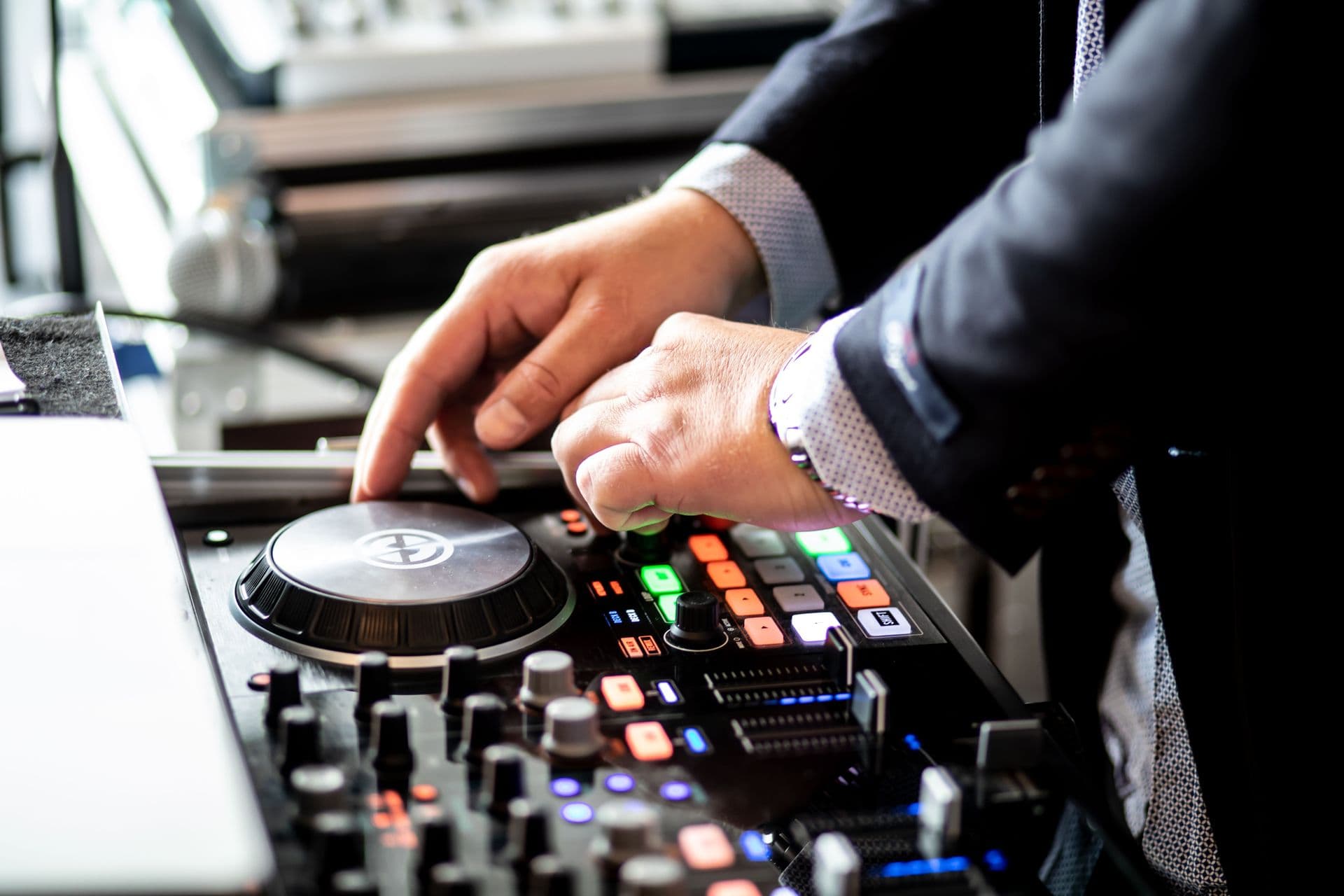 Hands mixing on a professional DJ controller
