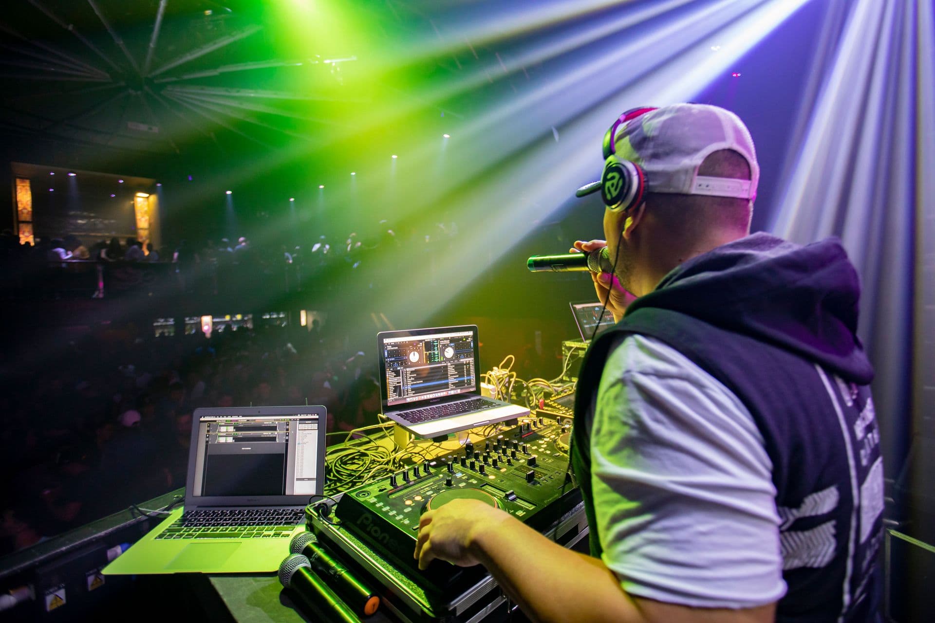 Lighting rig and intelligent fixtures over a DJ position