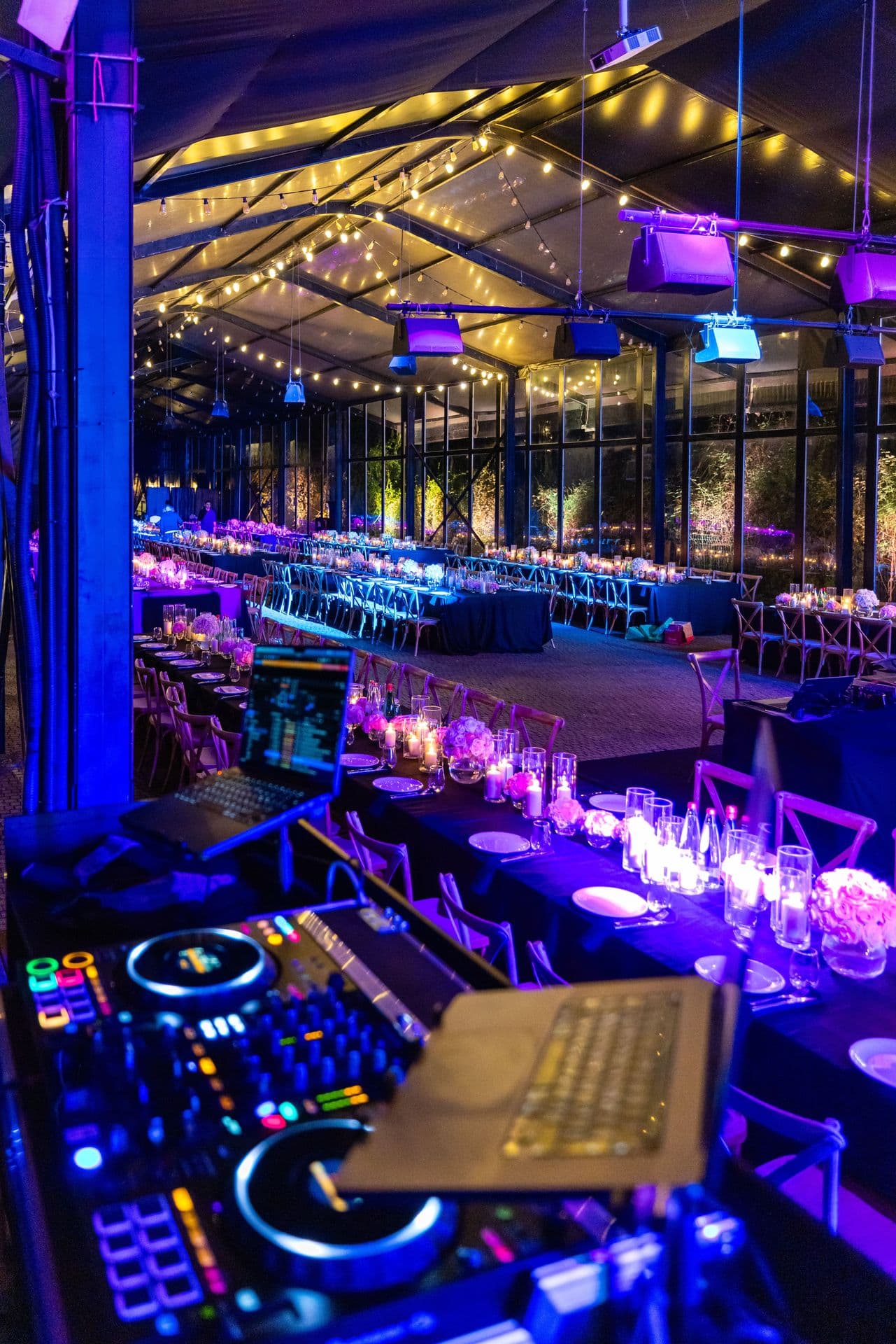 Reception venue washed in coloured architectural up-lighting